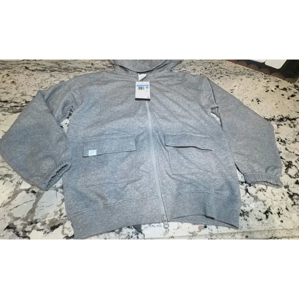 Kids size MEDIUM NIKE oversized fit gray zip up hooded jacket.